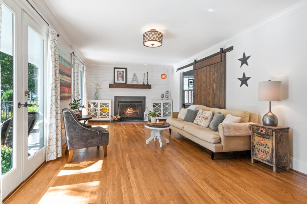 Bright living room with fireplace, vintage decor, and modern furniture design.