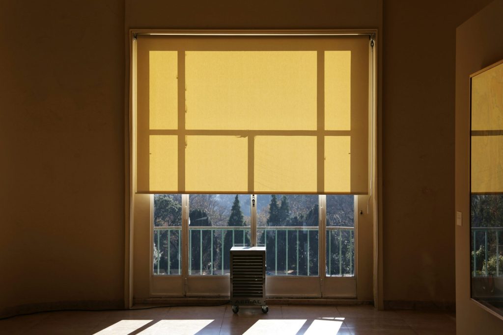 black table beside window