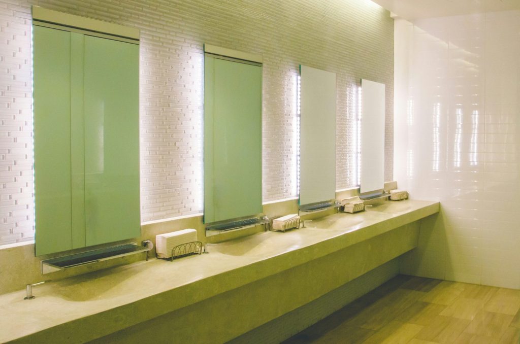 a row of sinks in a public restroom
